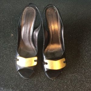 Diane von Furstenberg black leather heels with gold bar accent, size 7.5…
